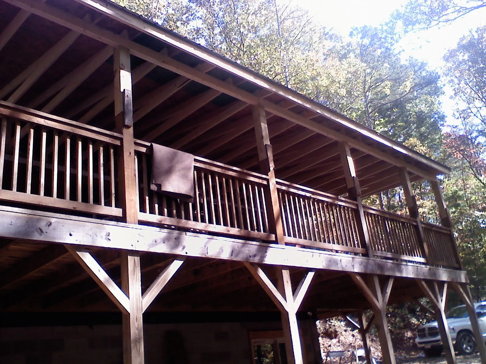 Timber framing under a new elevated porch and deck — Roof Leak Repair in Hemlock by Roofing Brothers